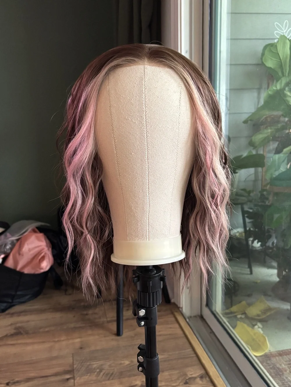 Carkira brown with pink face framing highlights. Petite but fits standard.